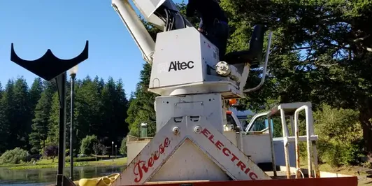 Reese Electric bucket truck with its boom raised